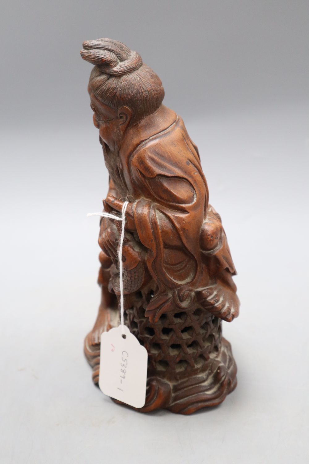 A Chinese bamboo figure of a fisherman, late 19th/early 20th century, H. 23.5cm